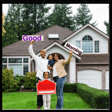 a family in front of a house holding signs that say good morning