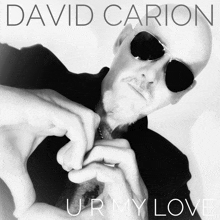 a david carion album cover shows a man making a heart shape with his hands