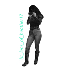 a black and white photo of a woman taking a picture with the caption bt lens of heather17