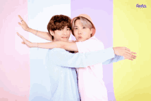 two boys hugging each other with the word festa on the bottom