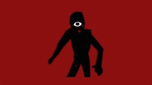 a silhouette of a person with one eye standing on a red background .