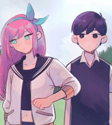 a boy and a girl are standing next to each other on a field .