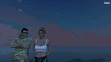 a man and a woman standing next to each other in front of a mountain in a video game