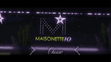 a purple sign that says maisonette70 on it