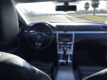 the inside of a volkswagen car with a steering wheel and dashboard