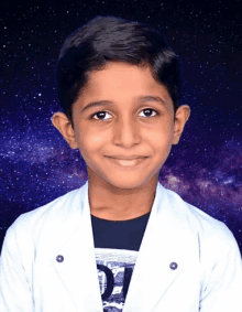 a young boy wearing a white jacket and a black shirt with the letter d on it smiles for the camera