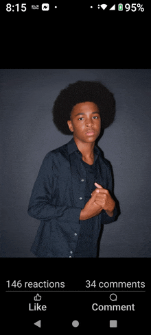 a picture of a young man with an afro has 146 reactions and 34 comments on it