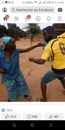 a man in a yellow shirt with the letter s on it stands next to an older woman