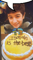 a boy is smiling in front of a birthday cake that says " isaiah is the best "