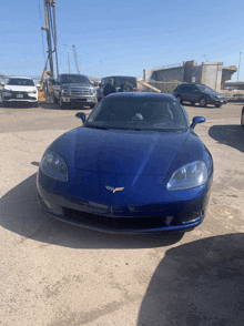 a blue sports car with the letter c on the front