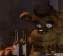 freddy fazbear from five nights at freddy 's is holding a bottle of wine in his hand .