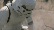 a storm trooper is wearing a helmet with a black stripe on the side