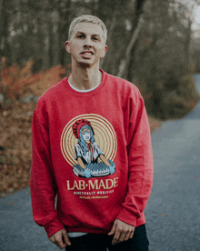 a man wearing a red lab made sweatshirt