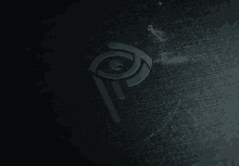 a dark background with a blue symbol on it that looks like an eye