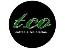 a logo for t.co coffee and tea station in a black circle