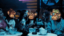 a group of people wearing monkey masks are sitting at a table