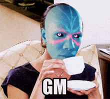 a woman with a mask on her face drinking from a cup with gm written on the bottom