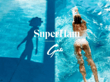 a woman in a white bathing suit is swimming in a pool with the words superham girl on the bottom