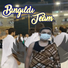 a man wearing a face mask is standing in front of a sign that says bungildi team