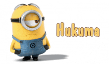 a minion with overalls and a g on his chest is standing next to the word hukuma