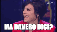 a woman holding a microphone with the words ma davero dicip on the bottom