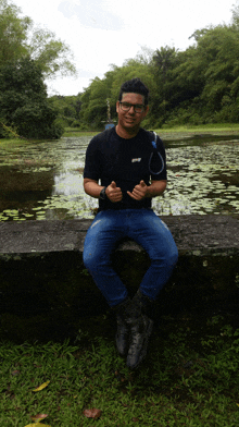 a man wearing a black shirt that says ' abercrombie ' on it