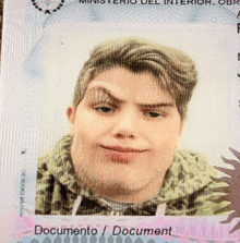 a man 's face is on a passport that says " documento / document "