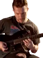 a man in an iron maiden shirt plays a guitar