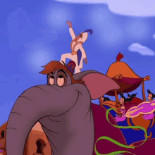 jasmine is riding on the back of an elephant in a cartoon