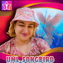 a woman wearing a pink hat with the name uml_songbird on it