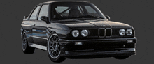 a black car with a bmw logo on the front of it