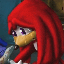 knuckles the echidna from sonic the hedgehog is crying with tears coming out of his eyes .