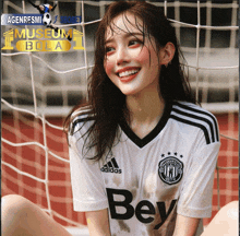 a girl wearing a white adidas jersey is smiling