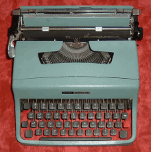 an olivetti typewriter is sitting on a red cloth