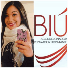 a woman is taking a selfie with her cell phone next to a logo for biu acondicionador reparador hidratante .