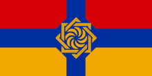 a red , blue and yellow flag with a yellow swirl in the middle .