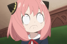 a girl with pink hair and black ears is making a funny face