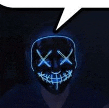 a person wearing a neon mask with a speech bubble above it .