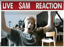 a boy wearing headphones is standing in front of a live sam reaction sign