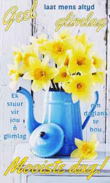 a bouquet of yellow flowers in a blue pitcher with the words " mooiste dag " on the bottom