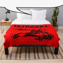 a bed with a red blanket on it that says ultrakill