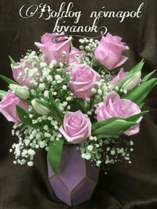 a bouquet of pink roses and baby 's breath in a purple vase on a birthday card .