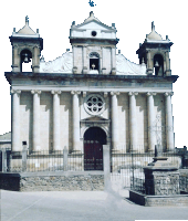 a church with columns and a cross on top