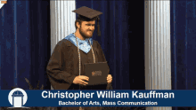 a man in a graduation cap and gown holding a diploma with the name christopher william kaufman on the bottom