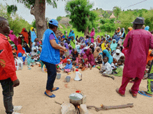 a woman in a blue vest with the word un on it