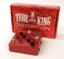 a red tube king distortion pedal sits in front of its box