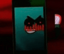 a close up of a cell phone screen with a cartoon face on it .