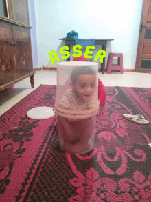 a child is sitting inside of a plastic container with the word asser on it