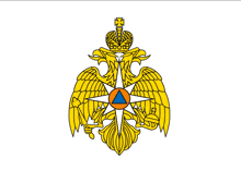 a gold and orange emblem with a crown and a triangle in the center