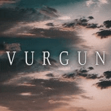 a picture of a cloudy sky with the word vurgun written in the middle .